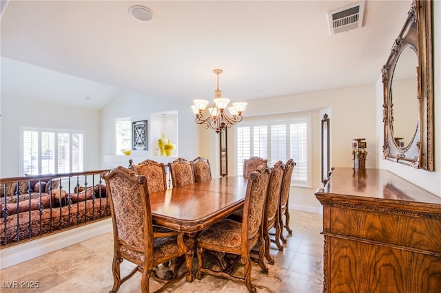 dining space with visible vents, an inviting chandelier, a healthy amount of sunlight, and vaulted ceiling