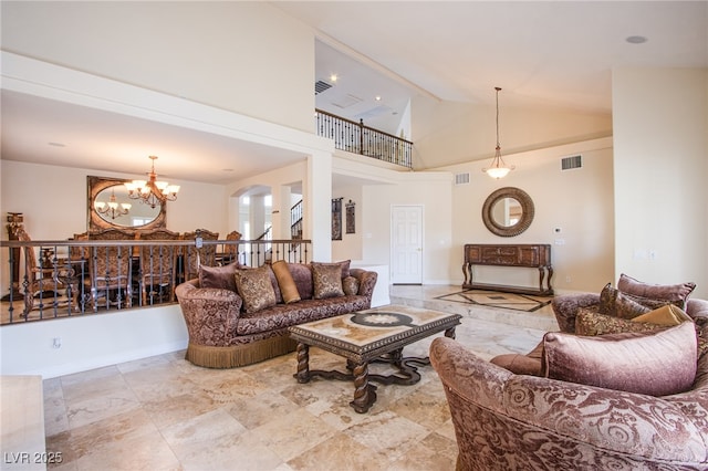 living area featuring an inviting chandelier, baseboards, visible vents, and high vaulted ceiling