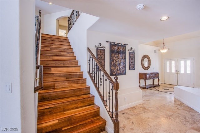 stairway with visible vents, recessed lighting, and baseboards