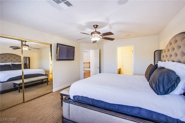 bedroom featuring baseboards, visible vents, a closet, and ceiling fan