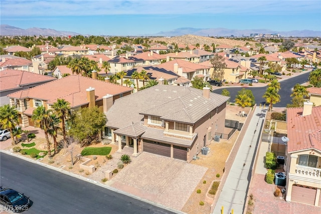 bird's eye view featuring a residential view and a mountain view