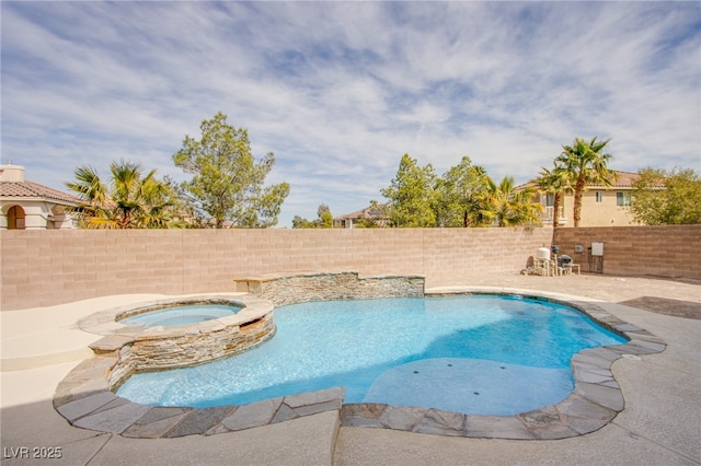 view of swimming pool featuring a patio area, a fenced backyard, and a pool with connected hot tub