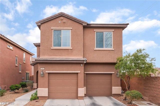 view of front of home with a garage, fence, driveway, and stucco siding