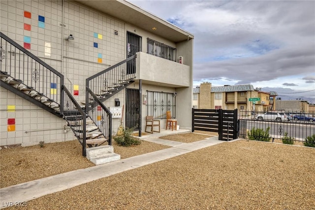 exterior space with stairs and fence