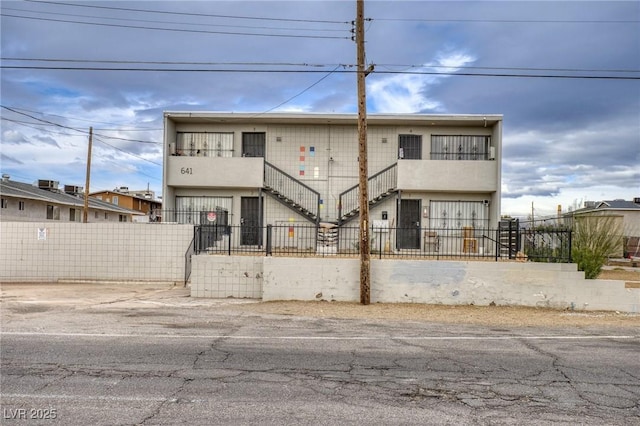 multi unit property featuring a fenced front yard