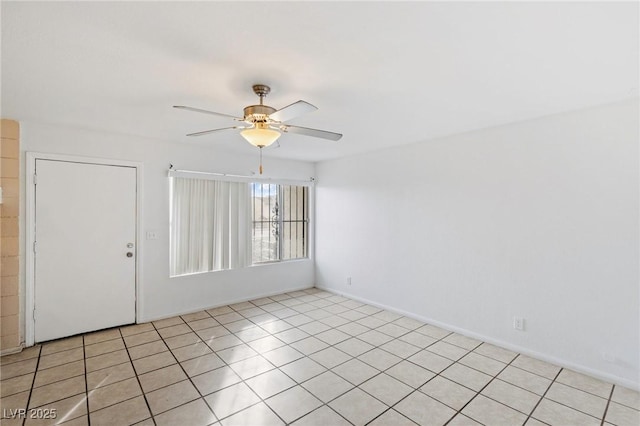 unfurnished room featuring light tile patterned flooring and ceiling fan