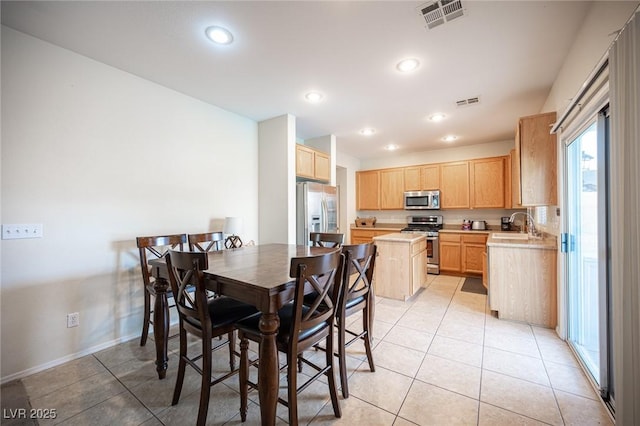 dining room featuring light tile patterned floors, baseboards, visible vents, and recessed lighting