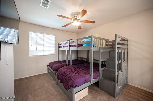 carpeted bedroom featuring visible vents and baseboards