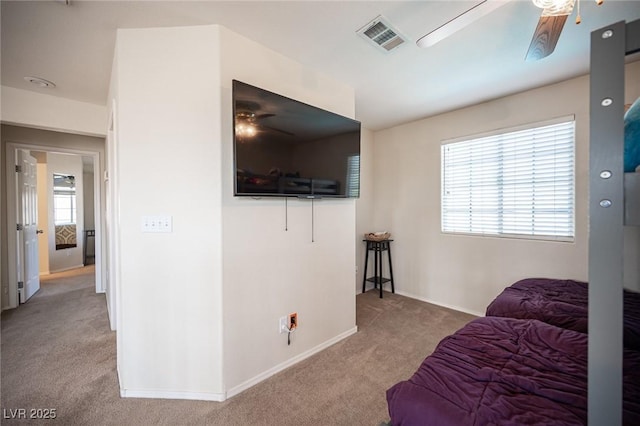 bedroom with baseboards, visible vents, ceiling fan, and carpet flooring