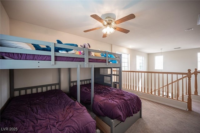 carpeted bedroom featuring visible vents