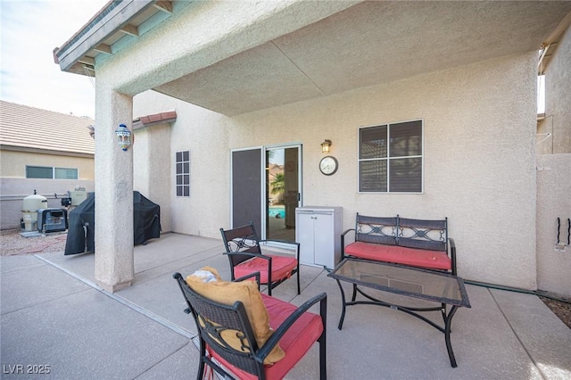 view of patio featuring a grill