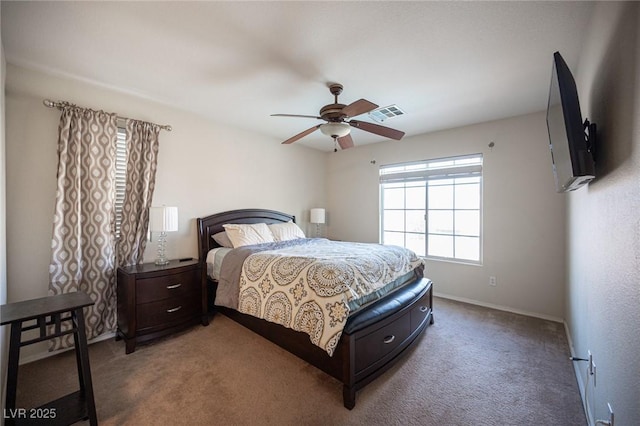 carpeted bedroom featuring baseboards and a ceiling fan