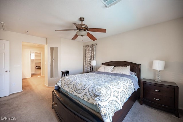 bedroom with ceiling fan, visible vents, baseboards, and light colored carpet