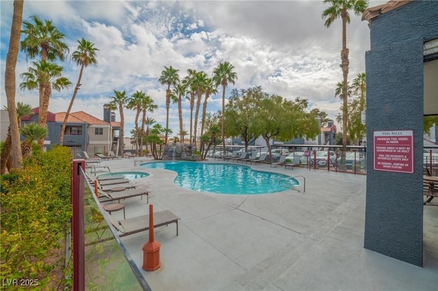 community pool with a patio