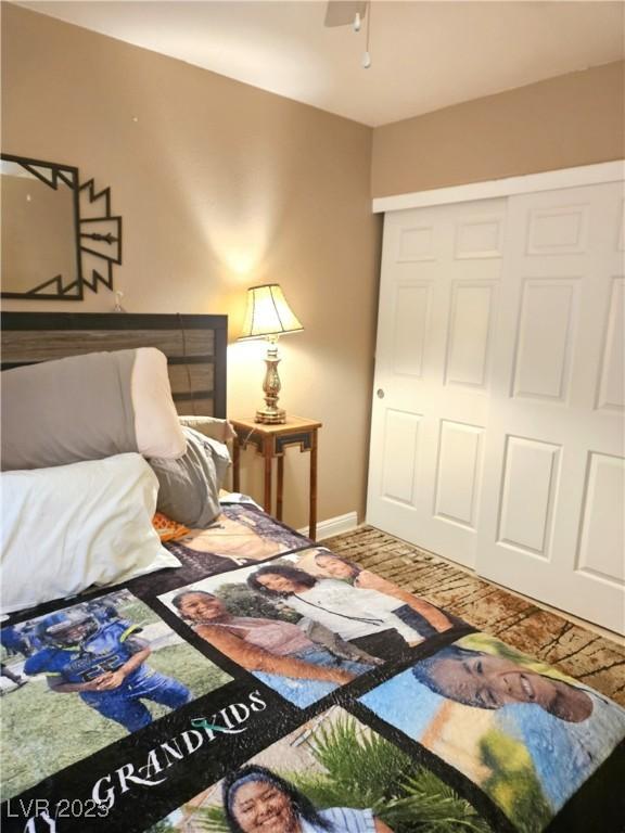 bedroom with a closet and baseboards