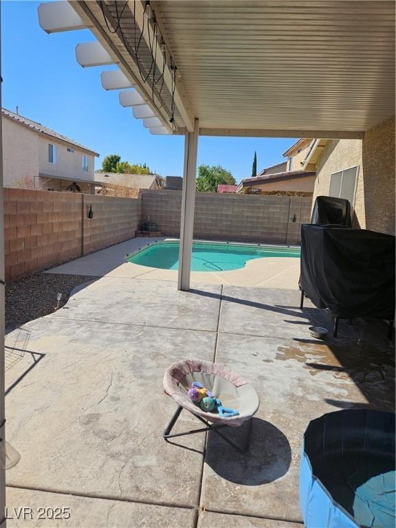 view of patio / terrace with a fenced in pool and a fenced backyard