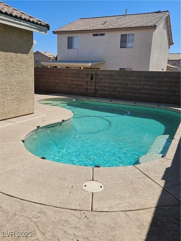 view of pool with fence and a fenced in pool