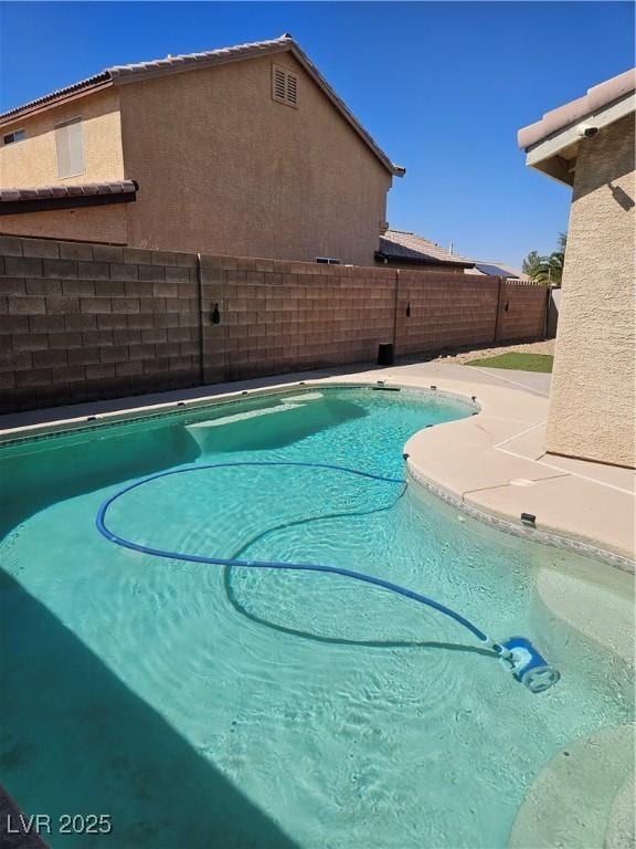 view of pool with a patio area, a fenced backyard, and a fenced in pool