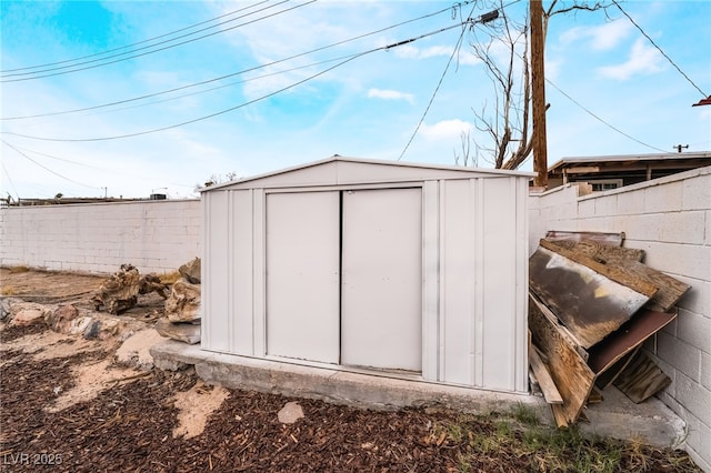 view of shed with a fenced backyard