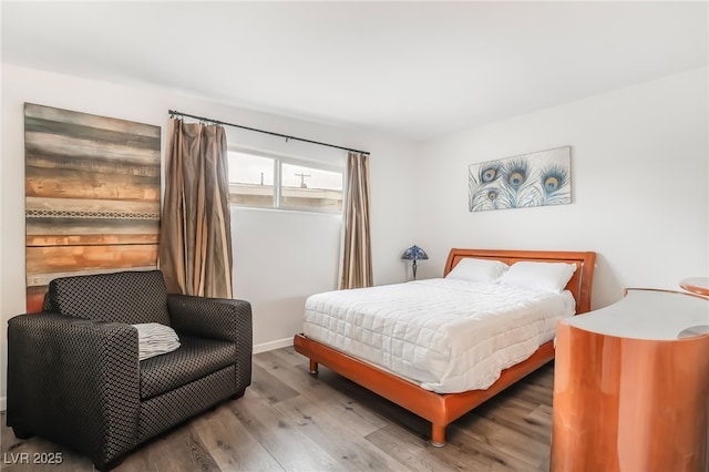 bedroom with wood finished floors