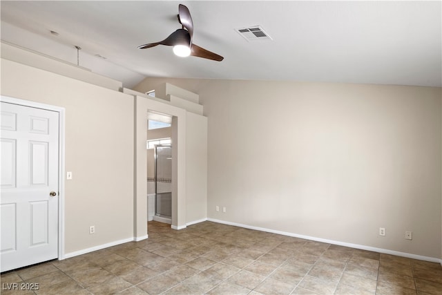 unfurnished bedroom with vaulted ceiling, ensuite bath, visible vents, and baseboards