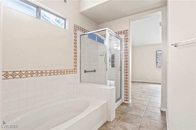 full bathroom with a stall shower, tile patterned flooring, and a bath