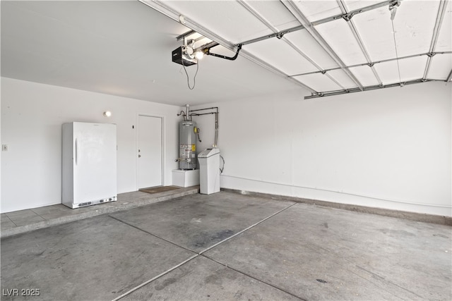 garage featuring a garage door opener, freestanding refrigerator, and gas water heater