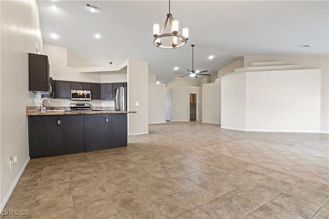 kitchen with ceiling fan with notable chandelier, stainless steel appliances, a peninsula, visible vents, and open floor plan