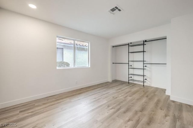 unfurnished bedroom featuring recessed lighting, baseboards, visible vents, and light wood finished floors