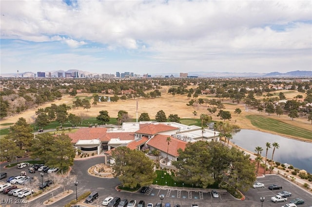 birds eye view of property with a water view and a city view