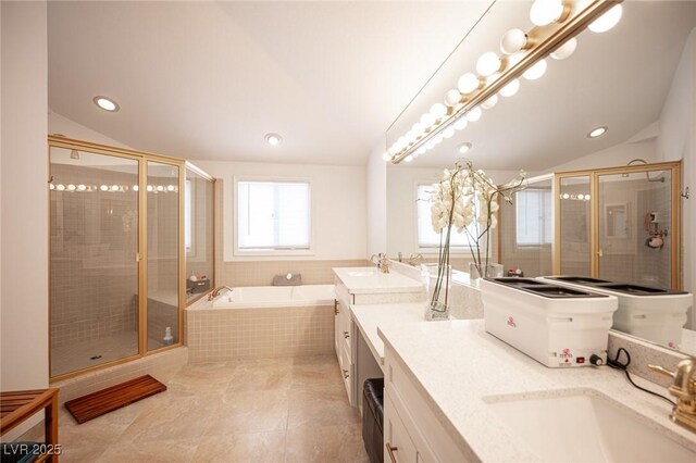 full bath featuring lofted ceiling, a sink, a bath, double vanity, and a stall shower