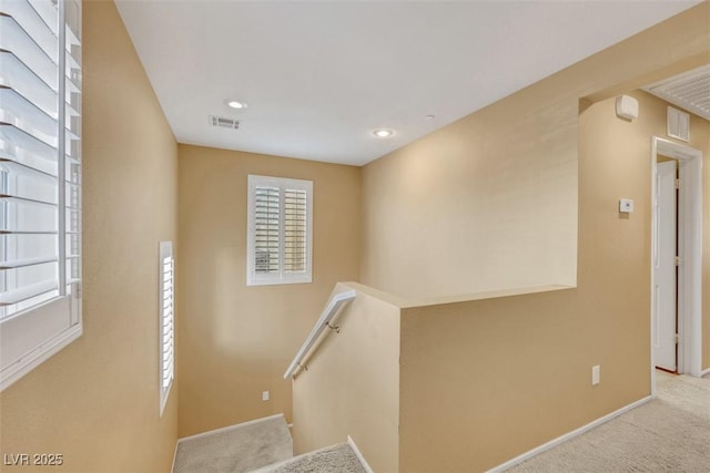 stairs with carpet, visible vents, baseboards, and recessed lighting