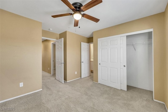 unfurnished bedroom with a ceiling fan, carpet, a closet, and baseboards