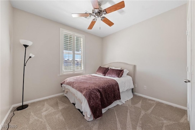 carpeted bedroom featuring a ceiling fan and baseboards