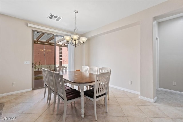 dining room with light tile patterned floors, visible vents, baseboards, and an inviting chandelier