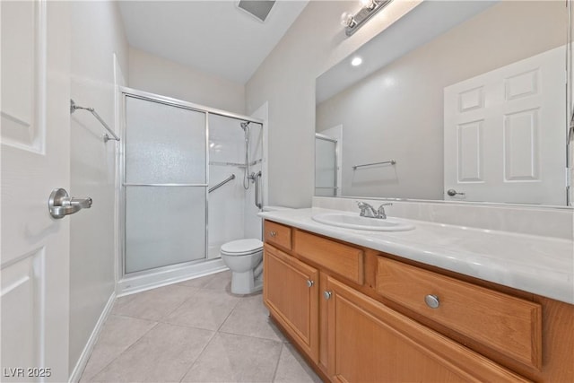 bathroom with vanity, an enclosed shower, toilet, and tile patterned floors