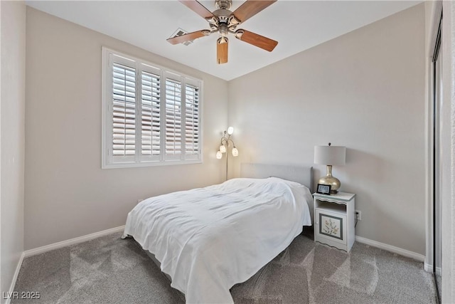 carpeted bedroom featuring ceiling fan and baseboards