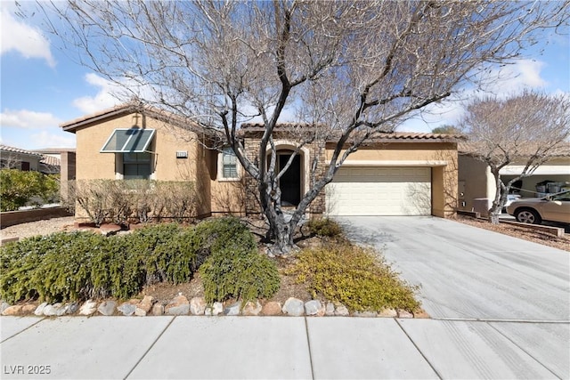 ranch-style house with a garage, concrete driveway, a tiled roof, and stucco siding