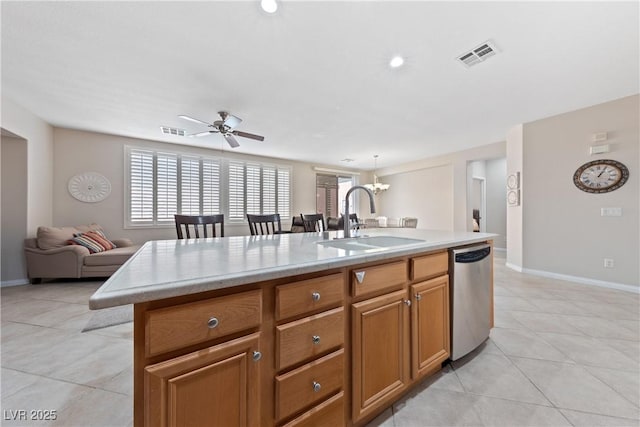 kitchen featuring a sink, visible vents, light countertops, and dishwasher