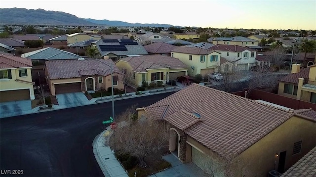 aerial view with a mountain view and a residential view