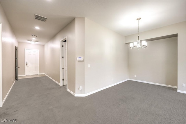 hallway with visible vents, dark carpet, baseboards, and an inviting chandelier