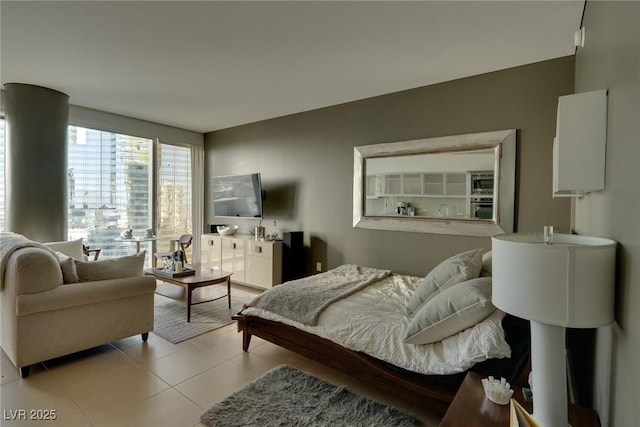 bedroom featuring light tile patterned flooring