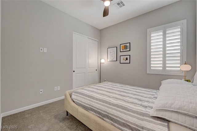 carpeted bedroom with baseboards, visible vents, and ceiling fan