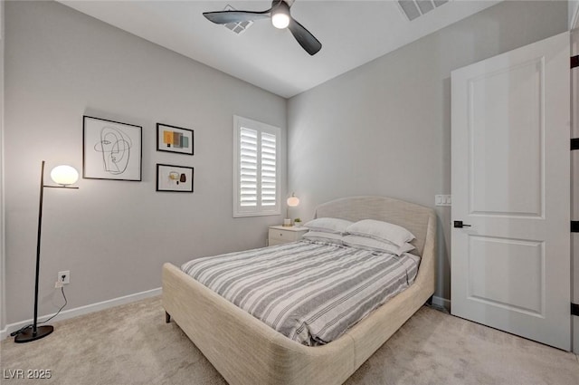 bedroom with baseboards, a ceiling fan, visible vents, and light colored carpet