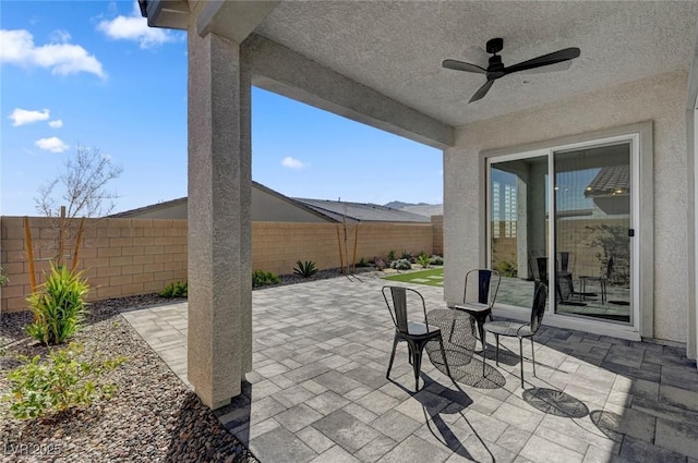 view of patio / terrace featuring a fenced backyard and ceiling fan