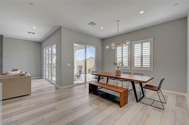 dining area featuring recessed lighting, visible vents, light wood-style flooring, and baseboards