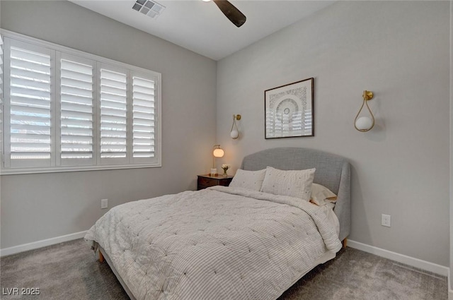 carpeted bedroom featuring ceiling fan, visible vents, and baseboards