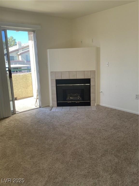 interior details featuring carpet, a fireplace, and baseboards