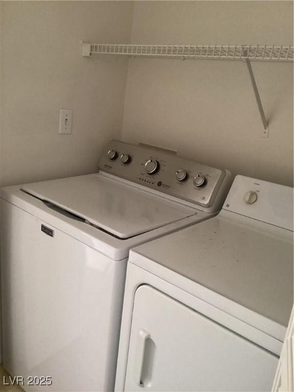 laundry room with washer and dryer and laundry area