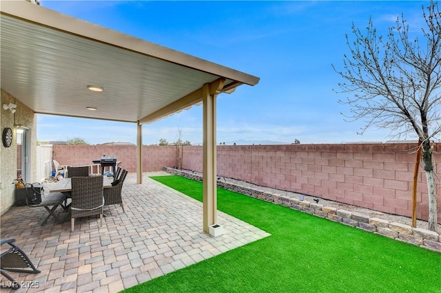 view of patio / terrace featuring outdoor dining space and a fenced backyard